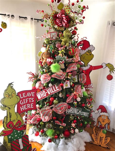 This Grinch waddles into your holiday home to take your Christmas goodies Pressing the button on his foot makes him walk freely around in his Santa suit as the classic tune "You&39;re A Mean One Mr. . Grinch tree hobby lobby
